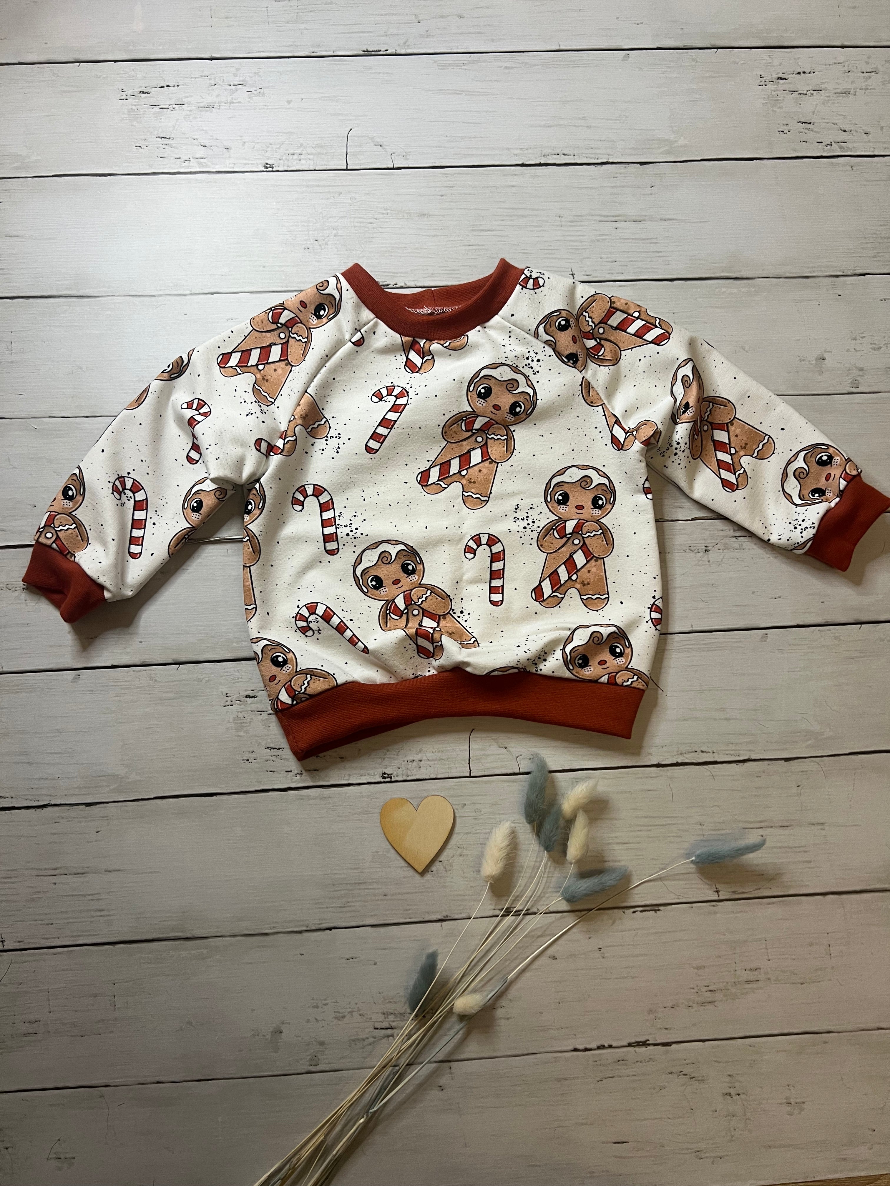 Zauberhafter Lebkuchen Pullover Gr. 80